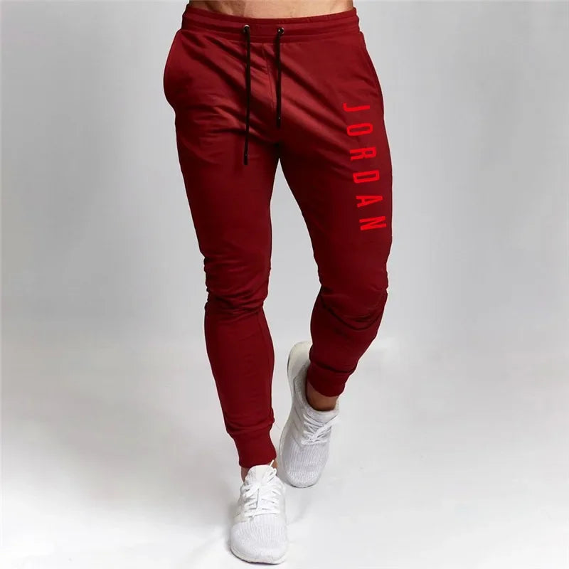 Pantalones elásticos sueltos y versátiles para hombre, pantalones deportivos transfronterizos de primavera y otoño, pantalones casuales, pantalones deportivos informales ajustados, S-3XL
