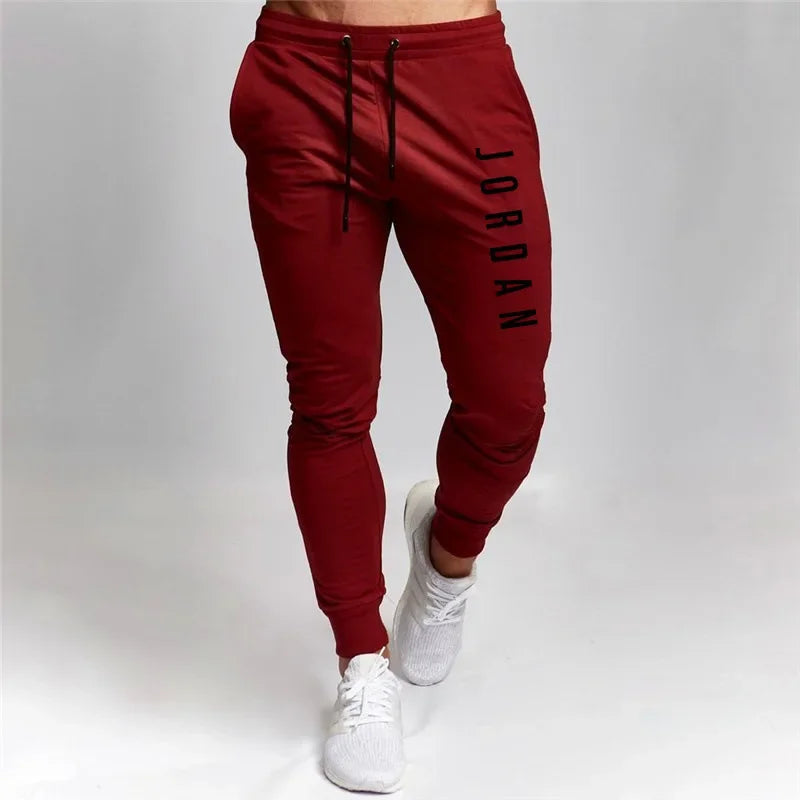 Pantalones elásticos sueltos y versátiles para hombre, pantalones deportivos transfronterizos de primavera y otoño, pantalones casuales, pantalones deportivos informales ajustados, S-3XL