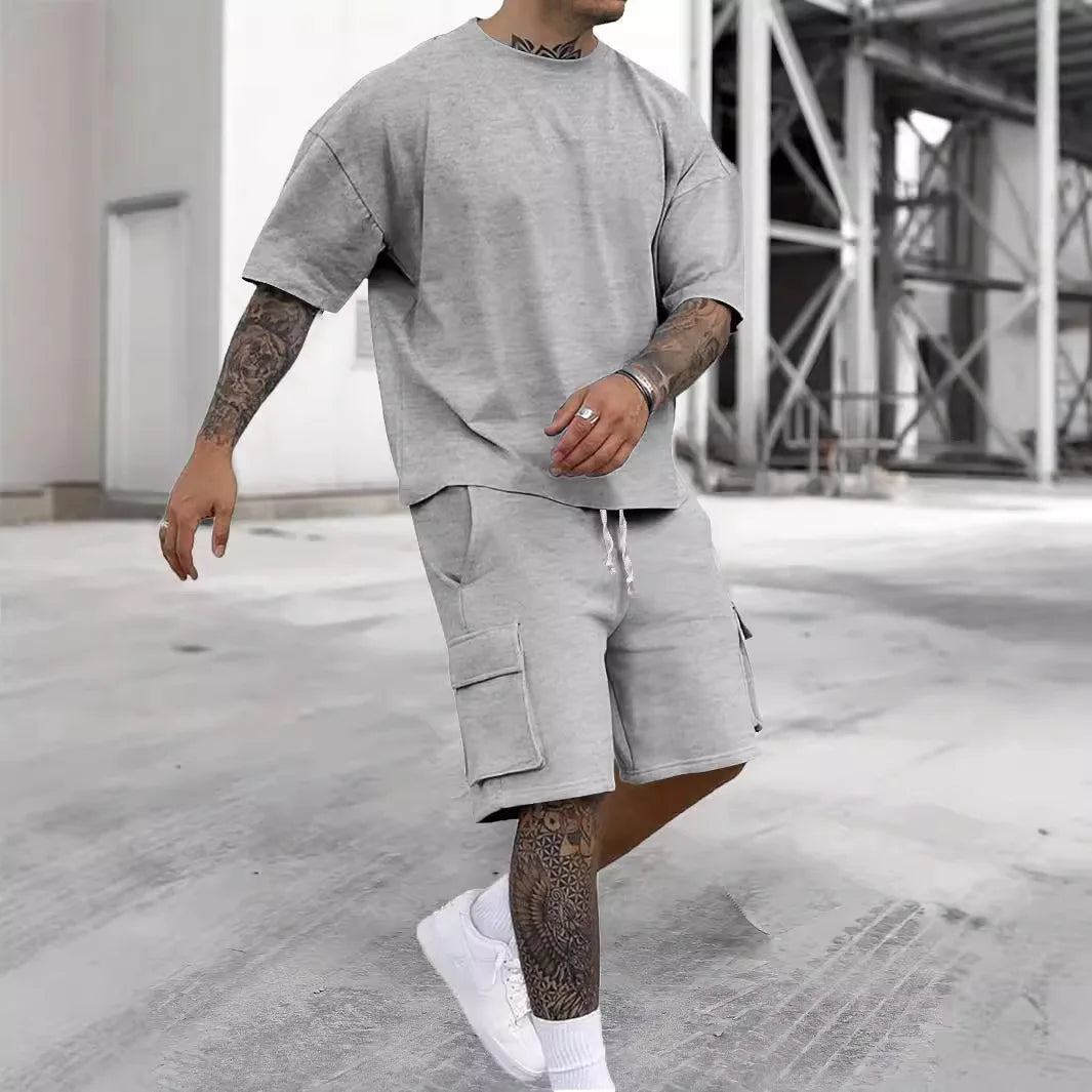 Nuevo estilo de verano, camiseta de moda y pantalones cortos de utilidad, conjunto de Color sólido, un traje informal y deportivo para hombre